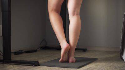 Watching Teen Calves At Standing Desk - voyeurhit.com